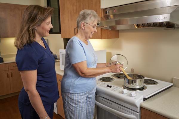 Patient Cooking in Kitchen