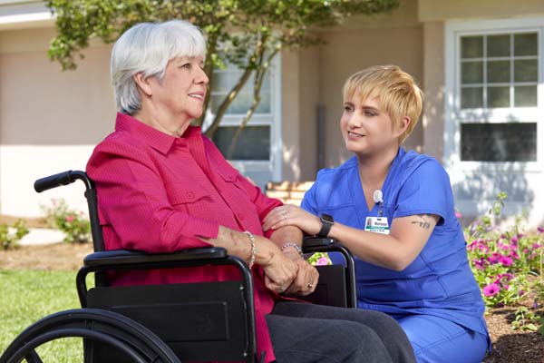 Nursing Staff Member With Patient